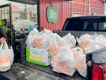 Bags of produce items loaded in the back of a truck